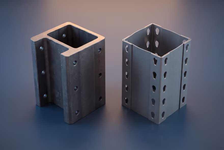 Two short column sections stood on end side by side: a heavy hot-rolled structural channel with bolt holes, and a thinner folded roll-formed column with punched slots.